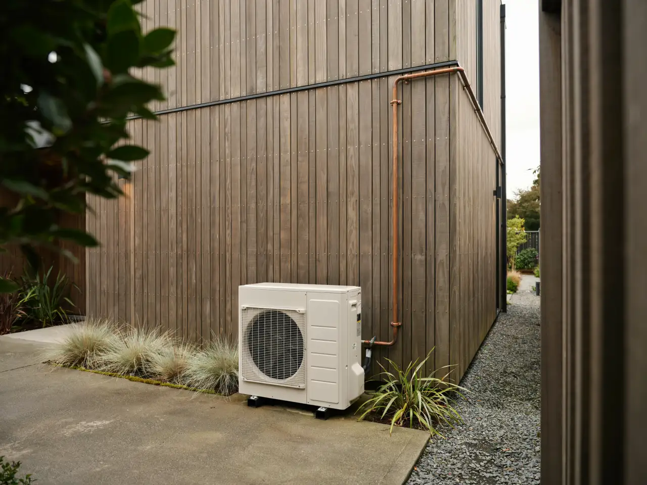 Heat pump outdoor unit on a Nelson home